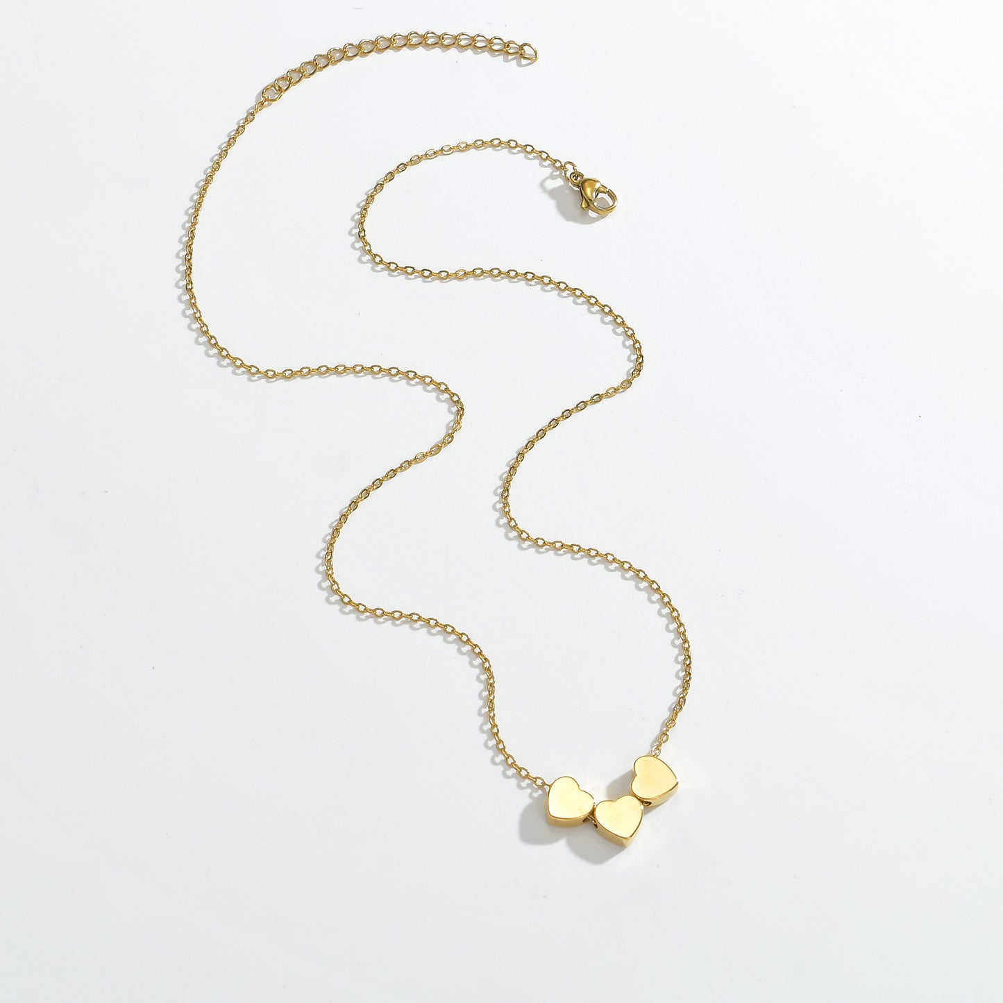 Minimalist Sleek Stainless Steel Pierced Heart Necklace With A Niche Designer Aesthetic For Women